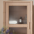 Elstowe Faux Bamboo and Fluted Glass 1-Door Cabinet, Nude Pink